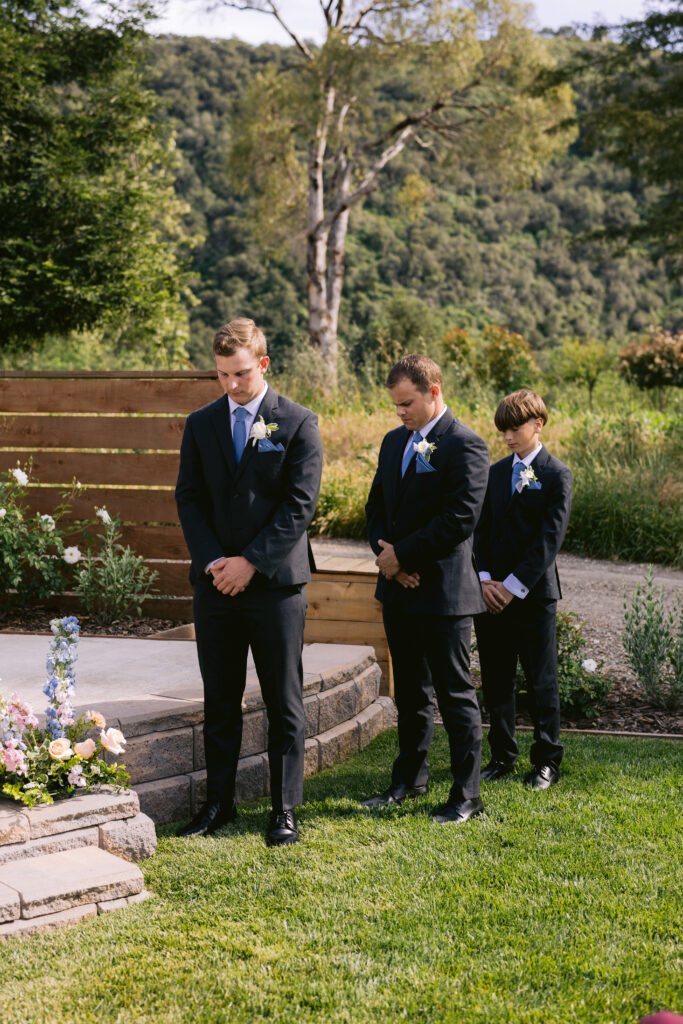 groomsmen and ring bearer at ceremony